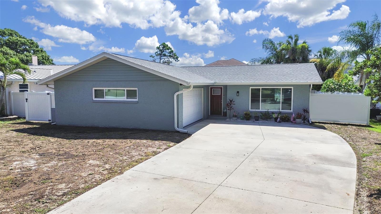 New roof, Windows, Kitchen, flooring, bathrooms, paint a/c and rear concrete patio!