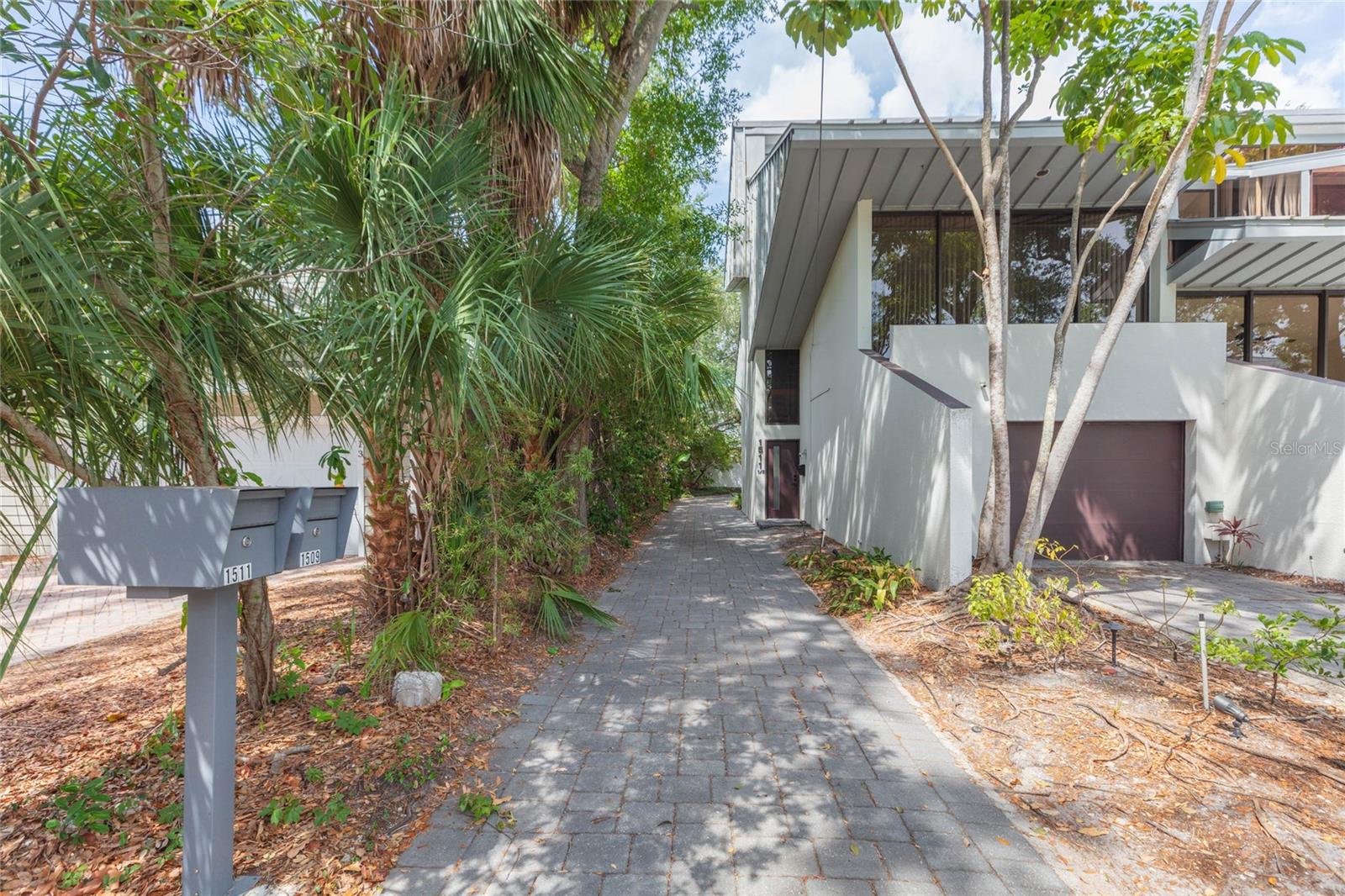 driveway leading to garage (in back)