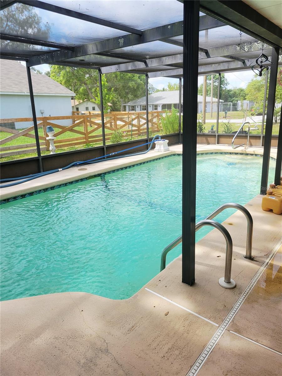 Inground pool with screen enclosure