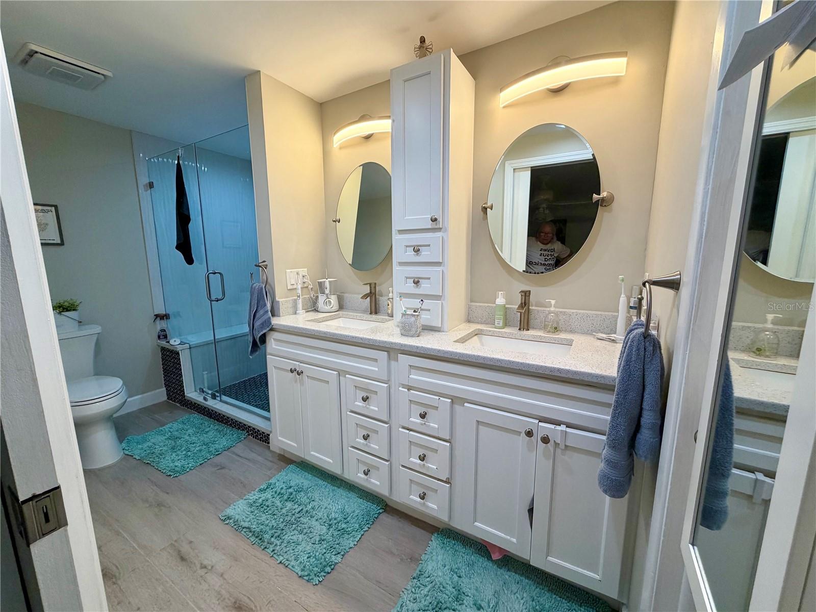 Master bath with all the custom upgrades! Walk-in shower with bench, dual vanities and sinks and a huge walk-in master closet!