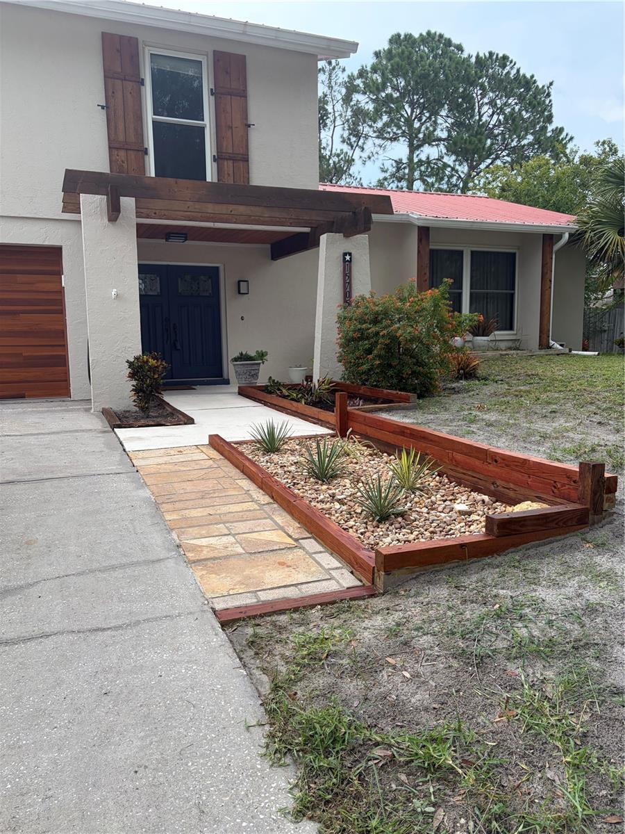 Recently stained planter to match house's rustic aesthetic