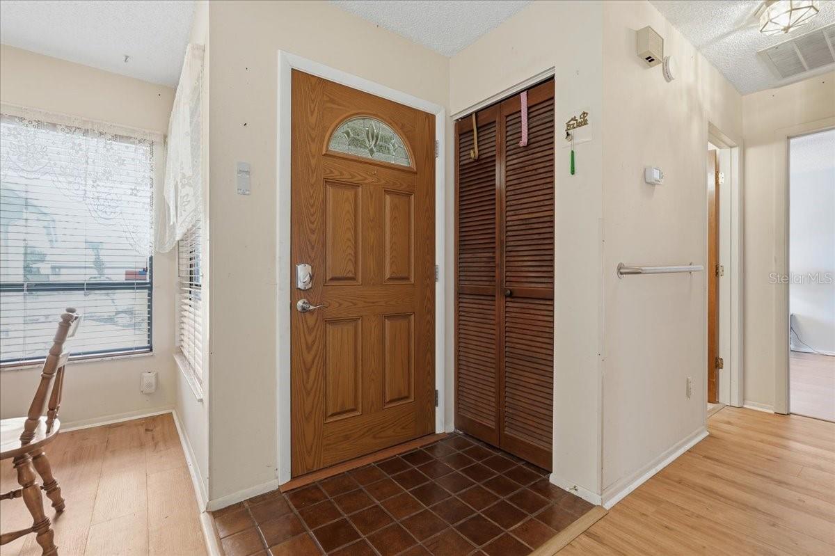 Tiled Foyer and coat closet