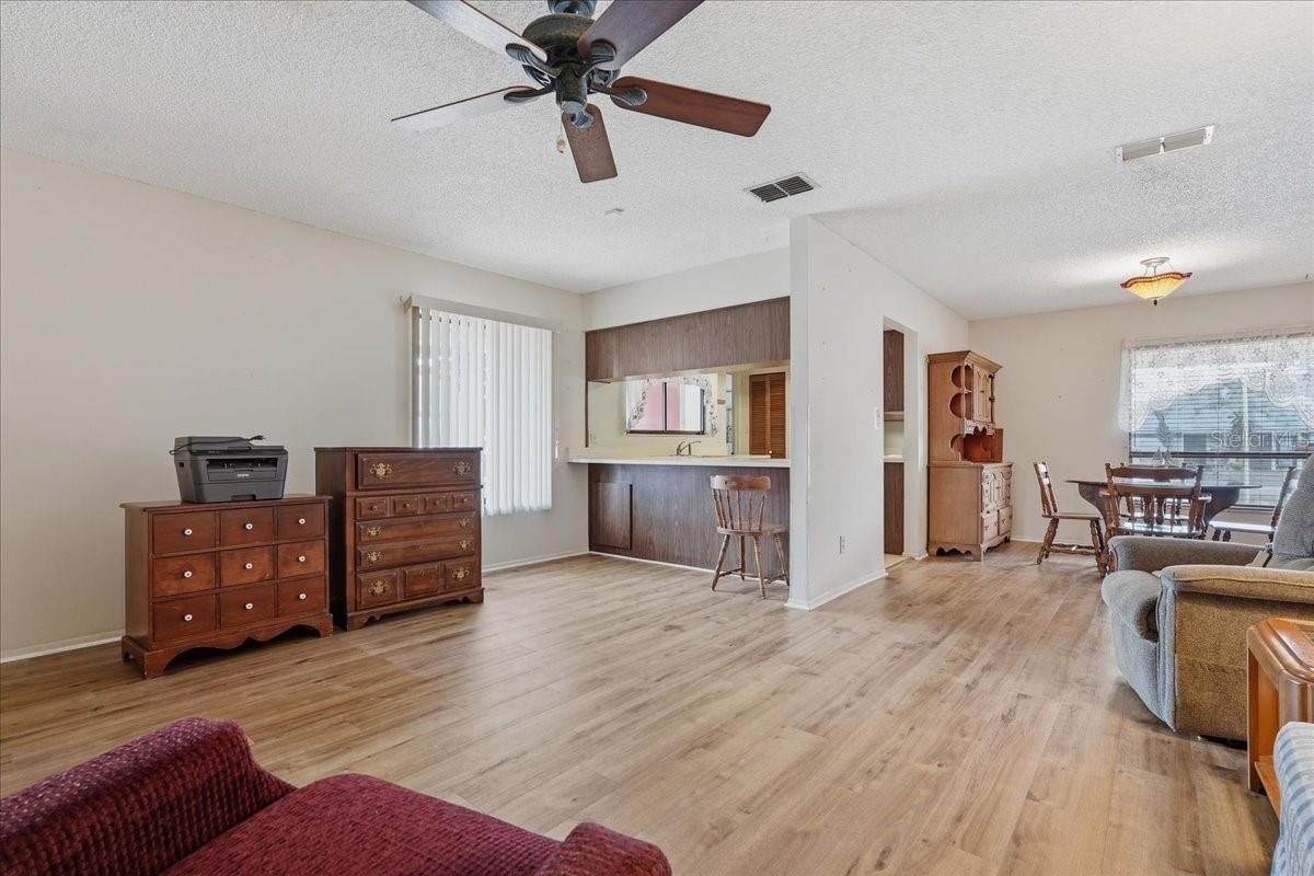 Living Room with View to Dining Room and Kitchen