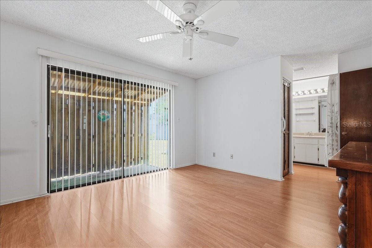 Primary Bedroom with Sliding Doors to Backyard