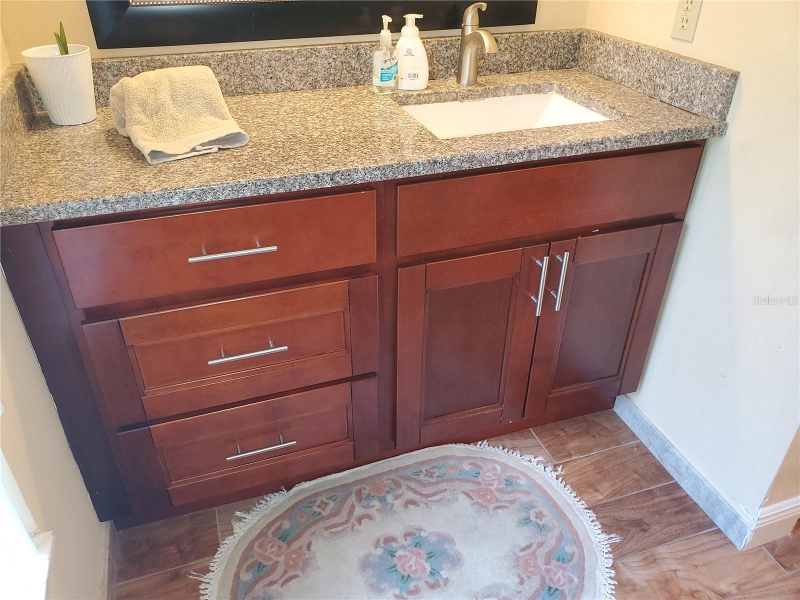Granite with wood cabintry