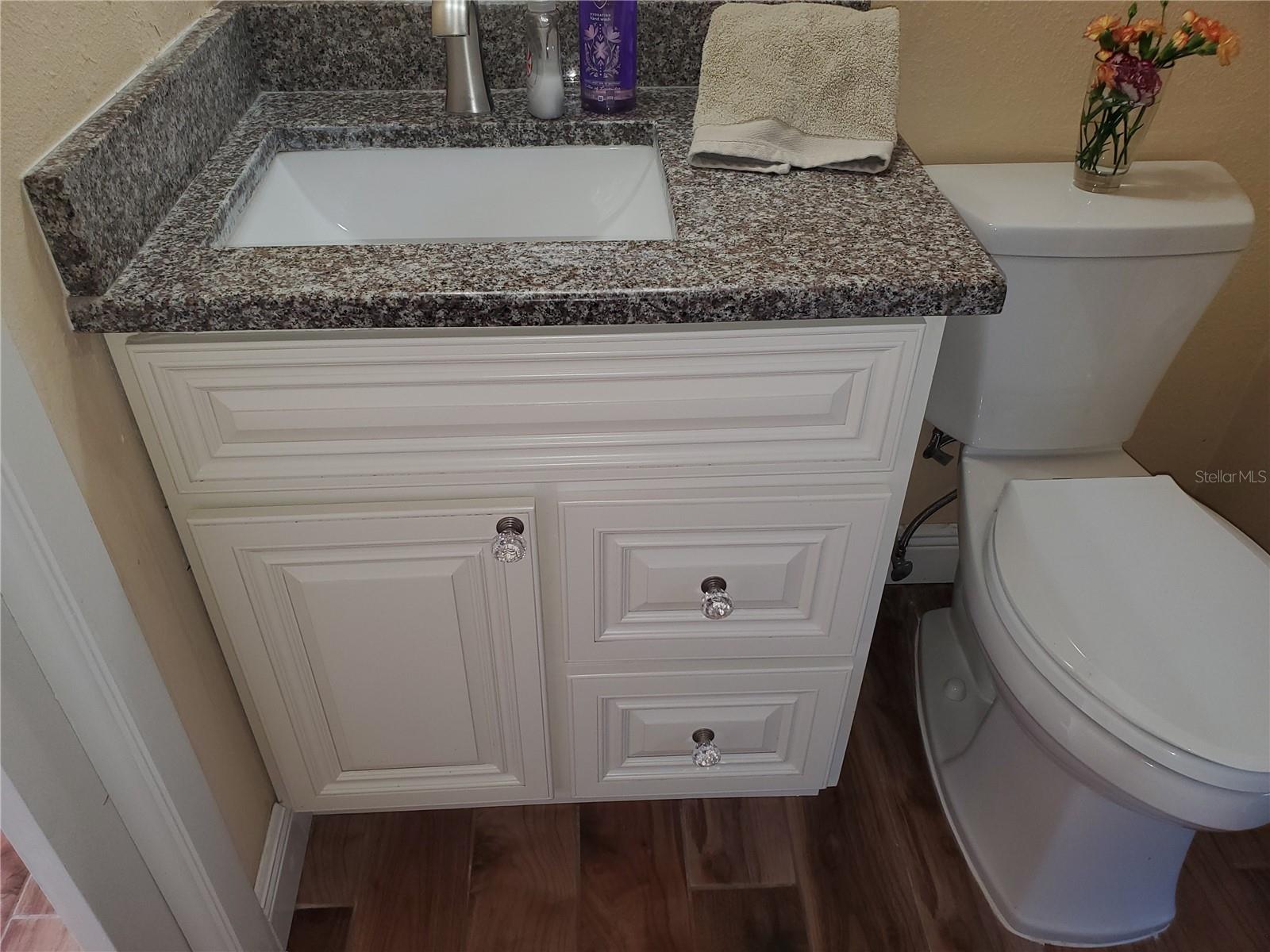 Granite with wood cabinetry