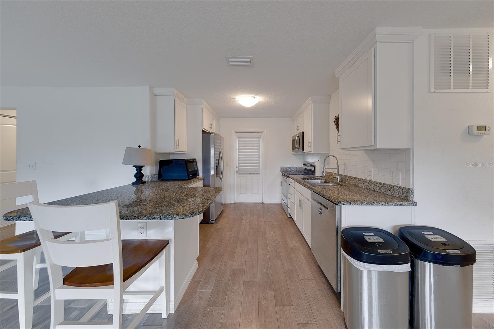 Kitchen leads to outdoor patio