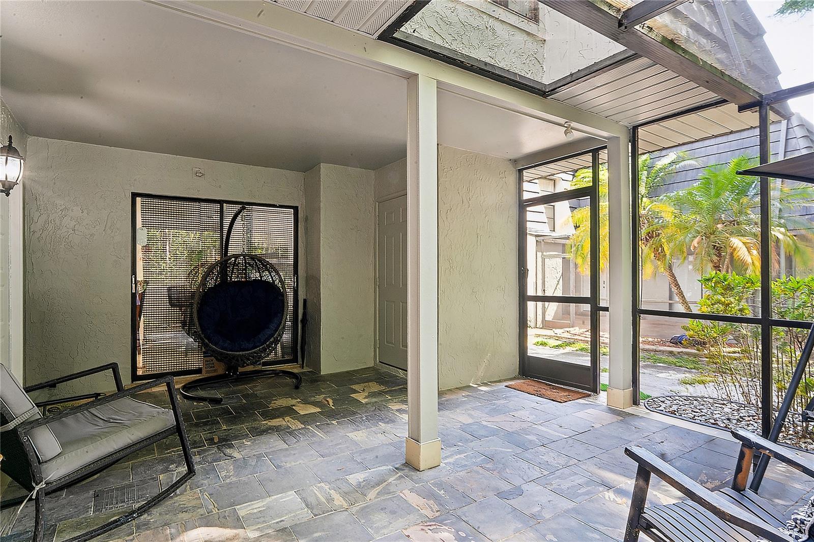 Large Front Screened and partially covered patio with Storage Closet
