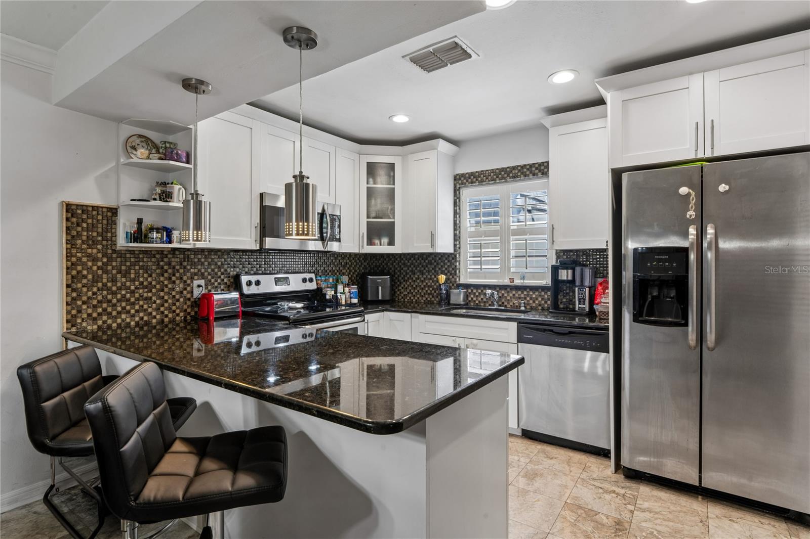 Updated Kitchen Stainless Steel appliances, Granite, Pendant lights, Breakfast Bar