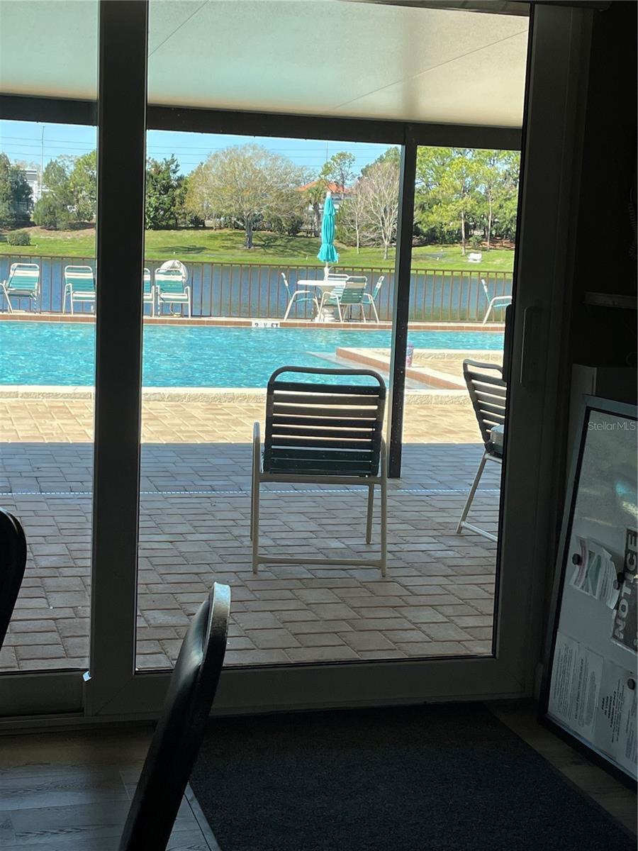 view from inside clubhouse to pool