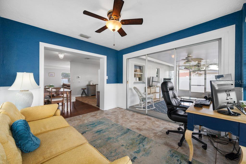 Florida Room with View to Screened and Covered Patio and Dining Room/Kitchen