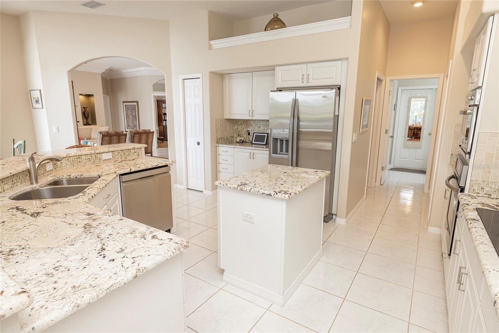 Kitchen layout with laundry and garage access
