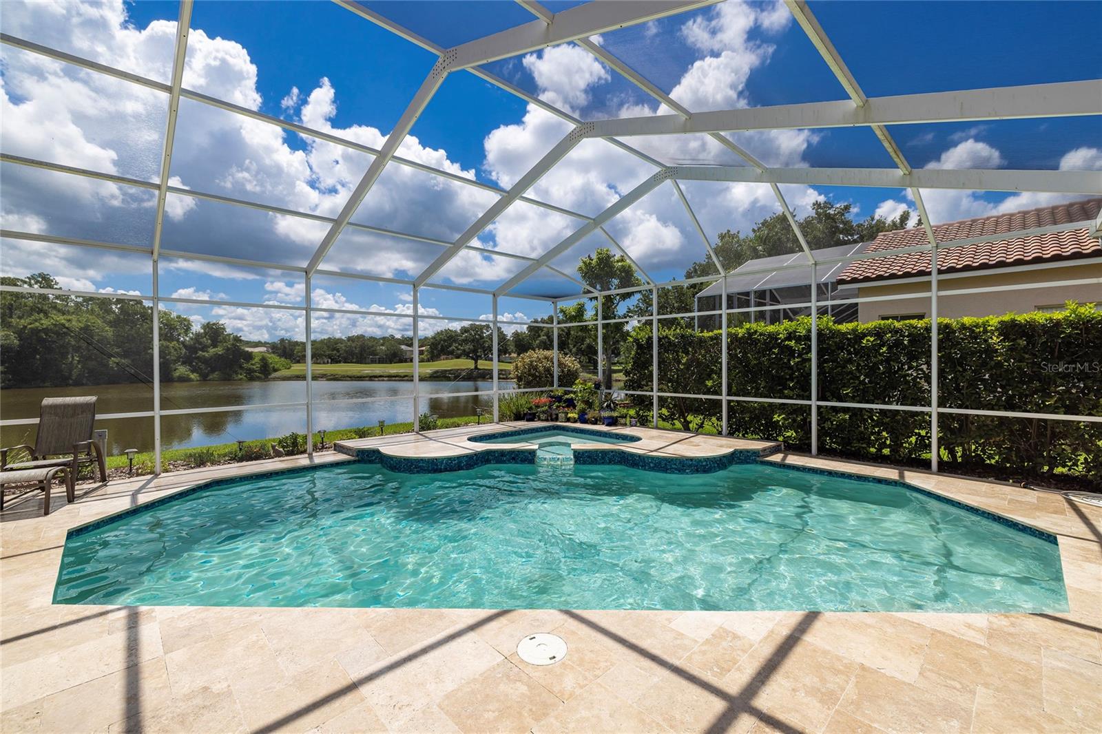 Updated solar pool and travertine deck