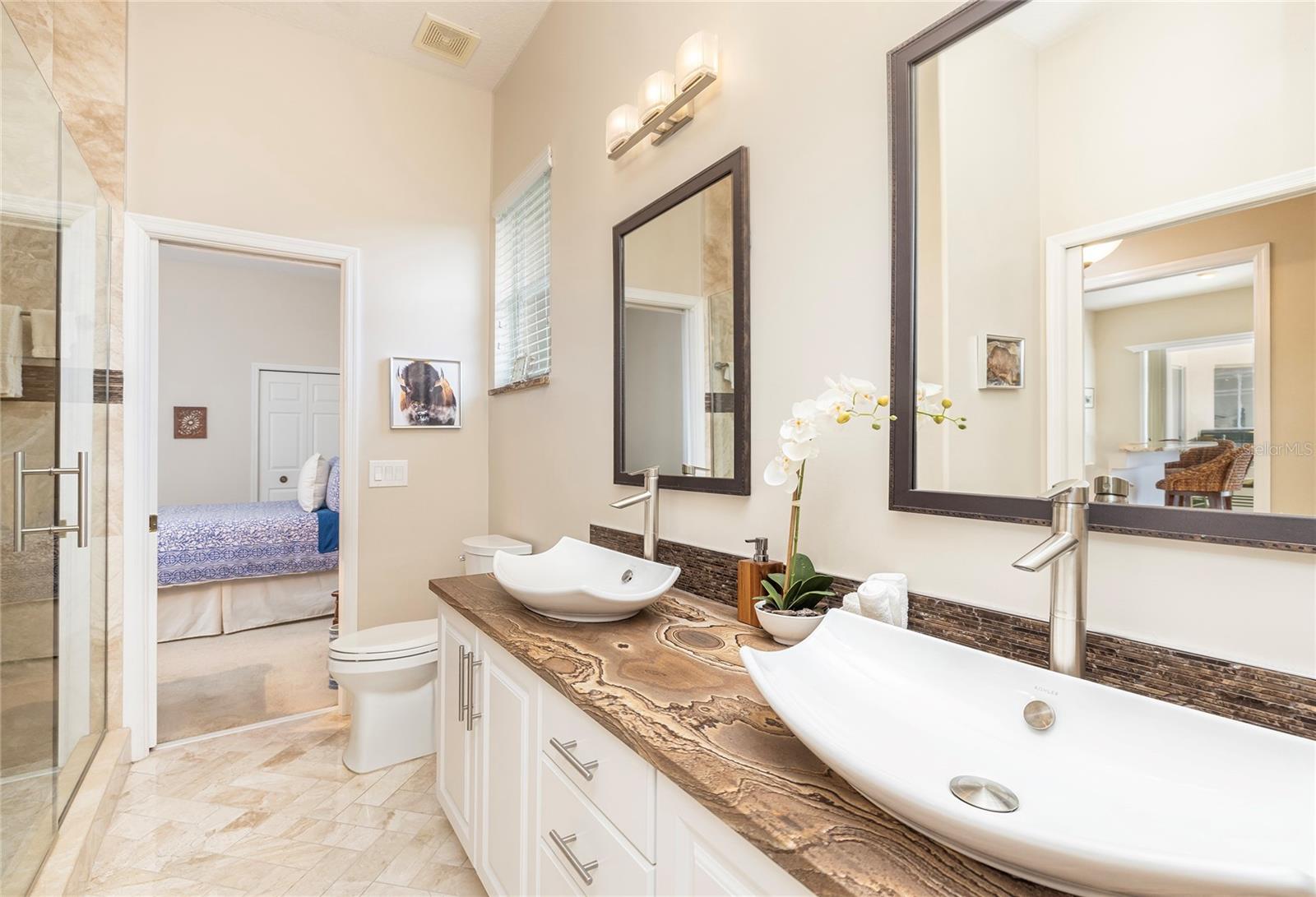 Second full bath with double sinks and upgraded Quartzite counter