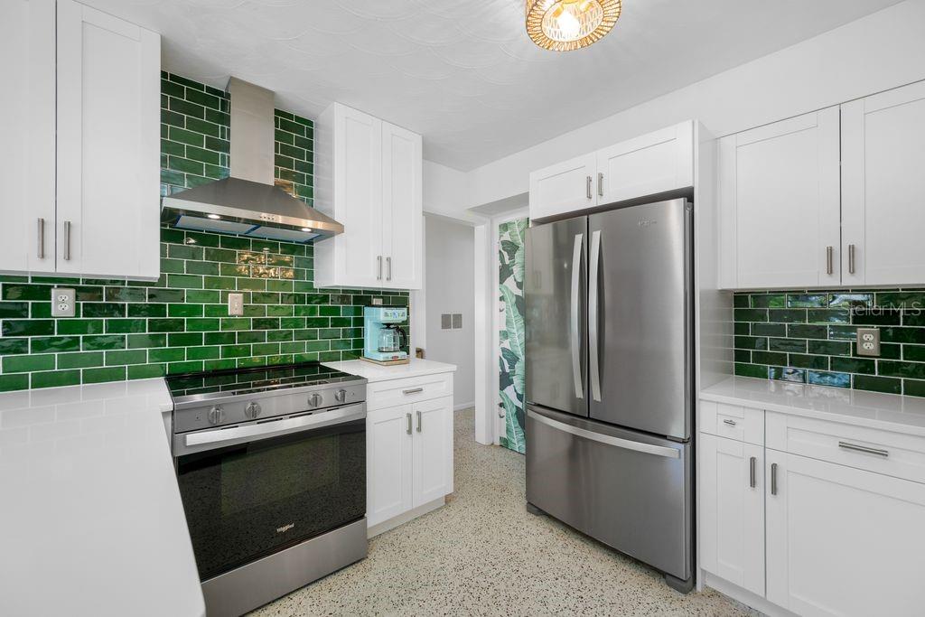 Don't you LOVE the Emerald Green Spanish Tile Backsplash?