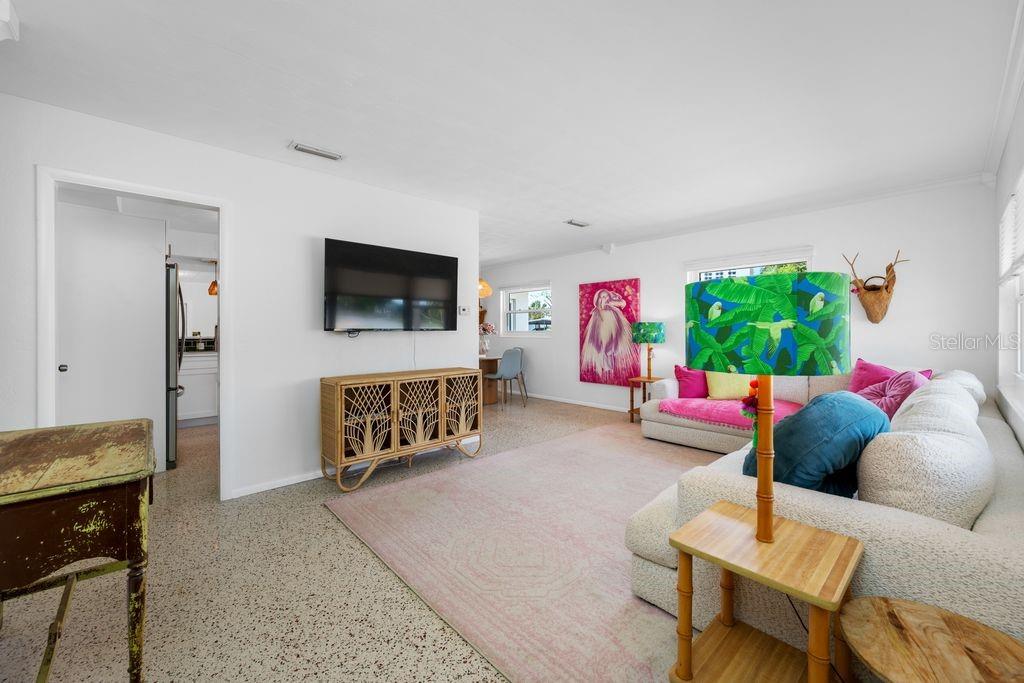 View from Front Door Entrance into the Living Room - Kitchen Entrance is to the Left and Dining Room is to the Right