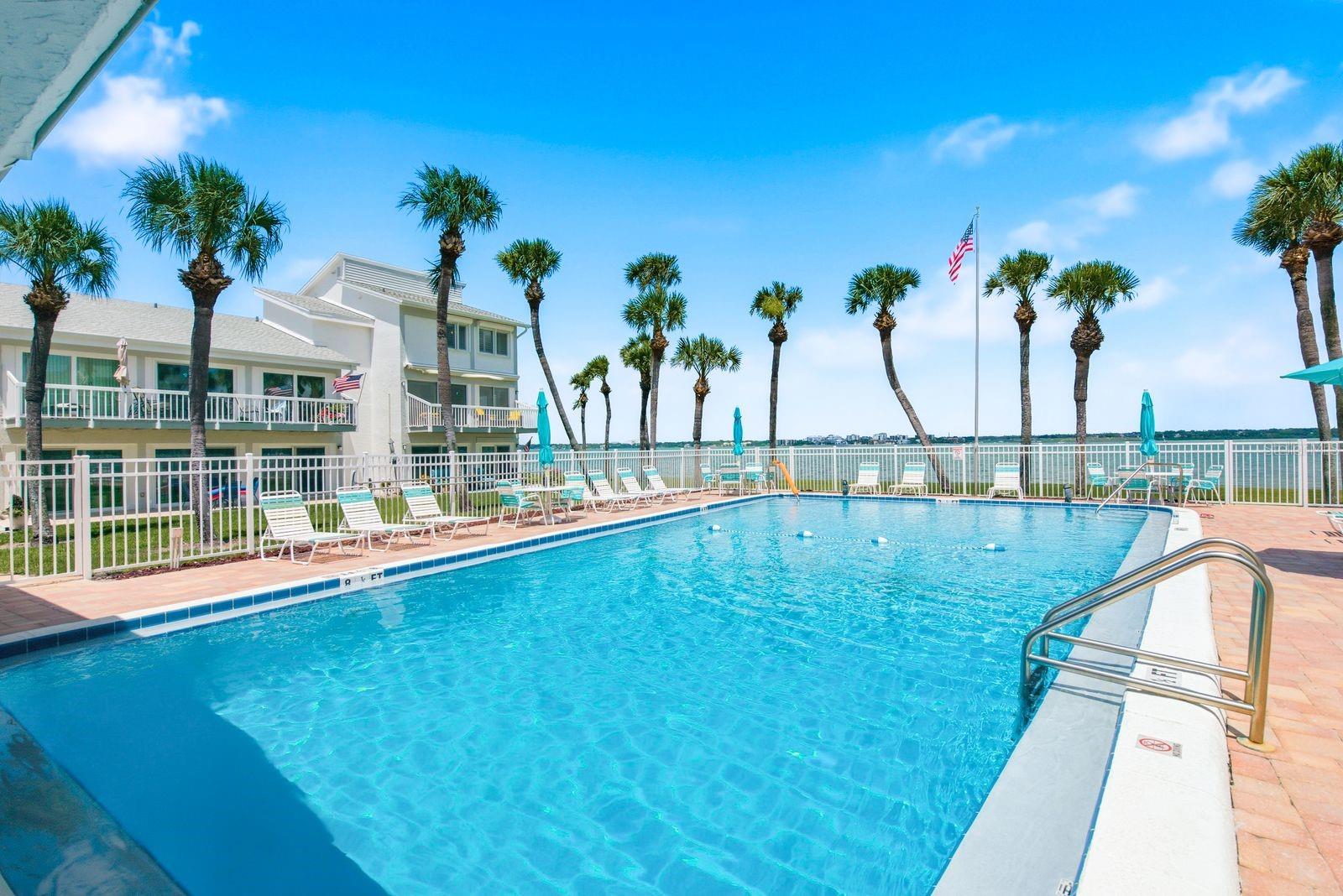 You can almost reach the pool from your balcony