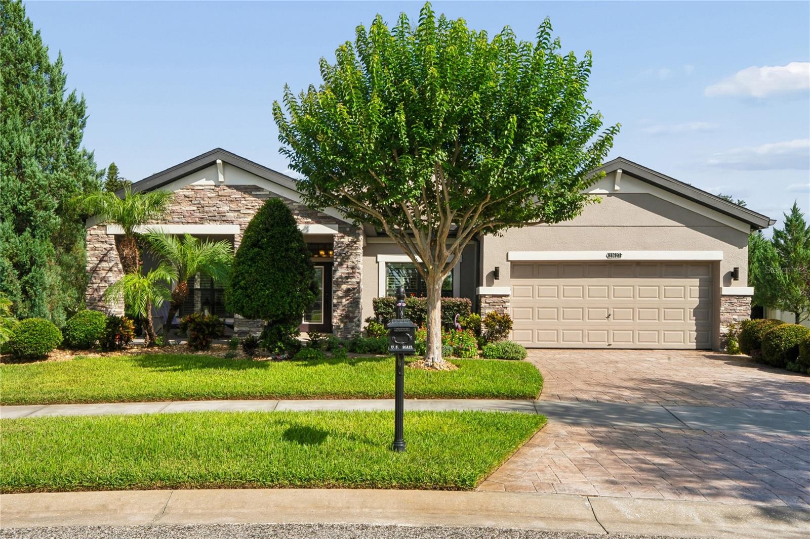 Florida Landscaping in the Front of the Home Gives Maximum Curb Appeal to 21627 Pearl Crescent Ct.