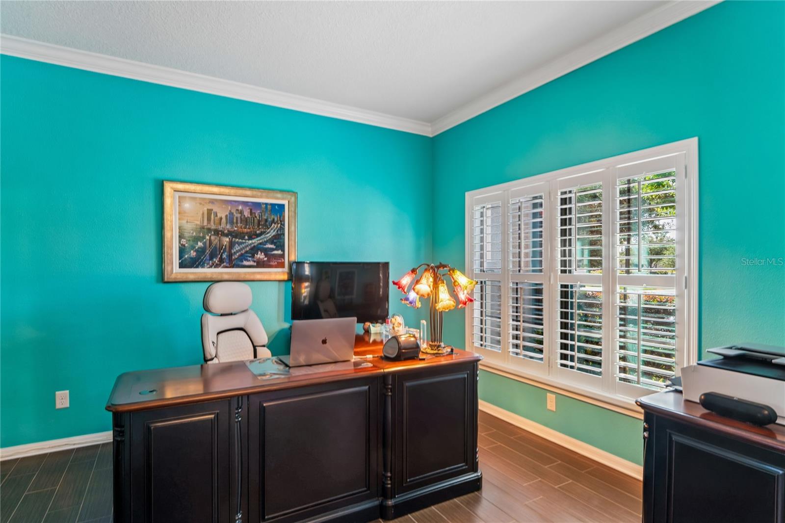 Large front window allows plenty of light to shine through to the Den/Flex Room