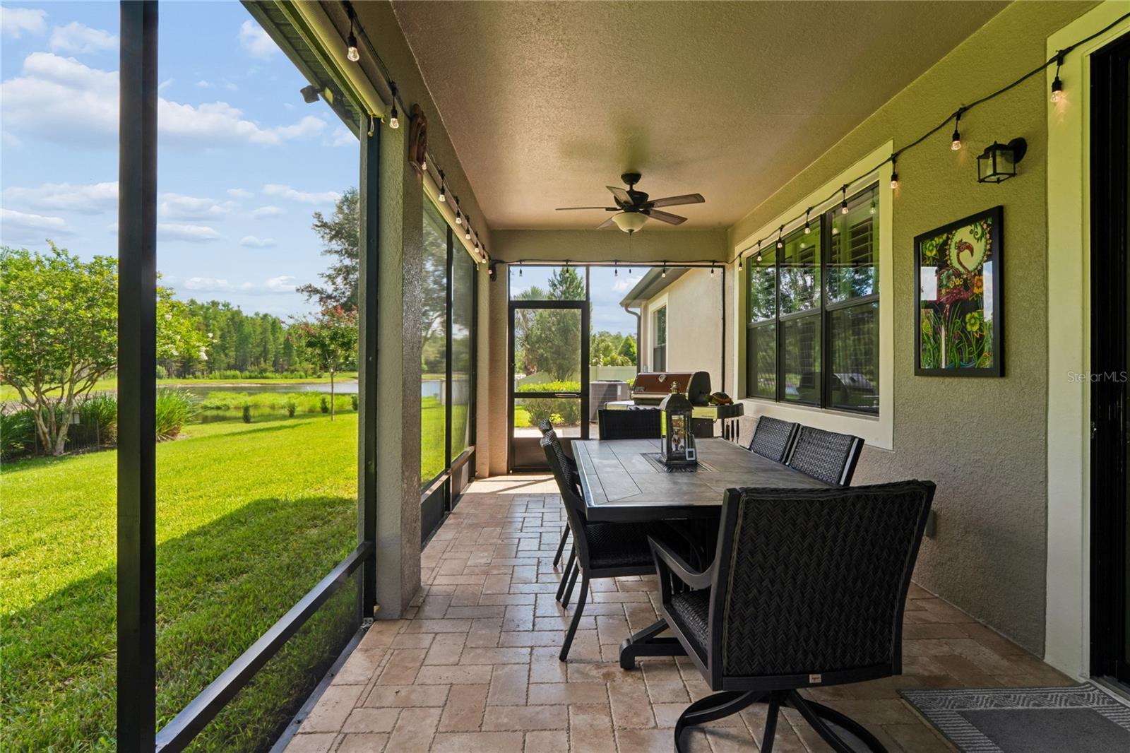 Extended Screened-In Entertainment Space with Added Fan and Additional Lighting