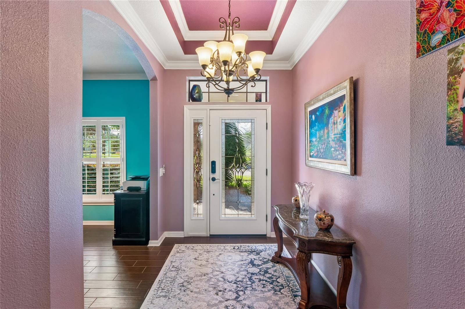 Soaring Double Trey Ceiling in the Entry Pairs Well with the Glass Door for a Regal Feel When You First Enter the Home. Notice the Crown Molding Throughout the Home.