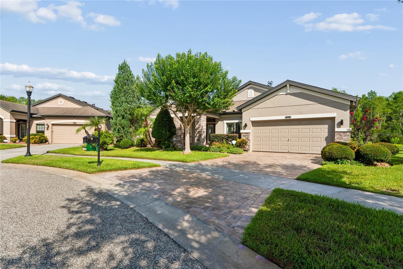 Immaculate Upkeep and View of the Paved Driveway Leading to Pearl Crescent Ct.