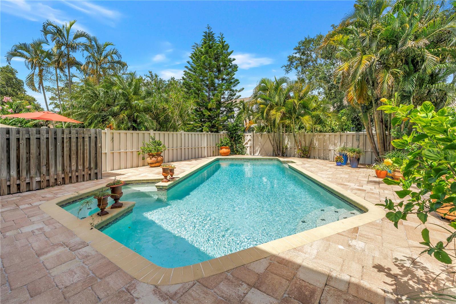 Not a small pool, room for small folks or large gatherings.  Paver Deck is in fantastic condition