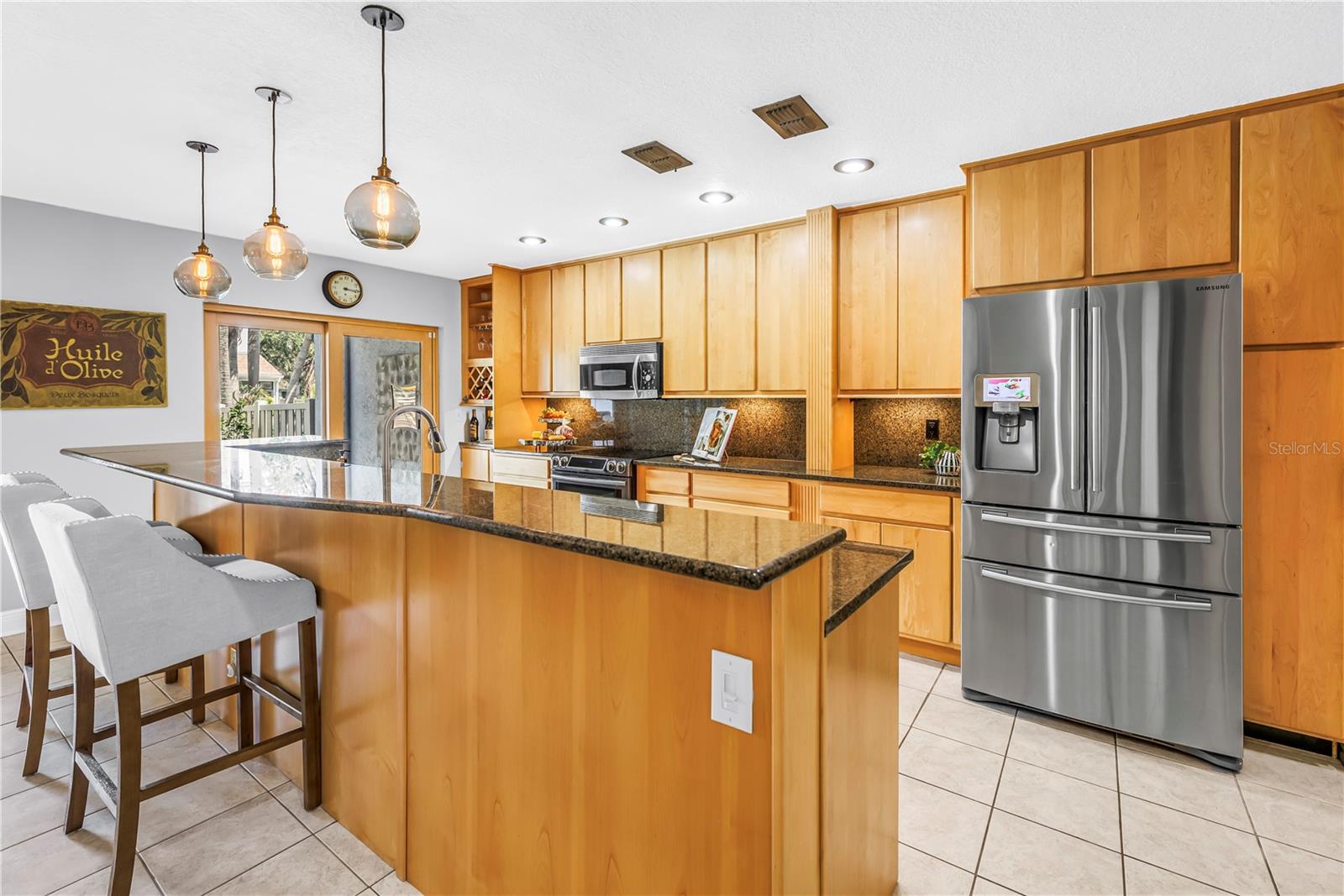 Social Entertaining Kitchen is Open with Seating for Guests to Entertain the Chef