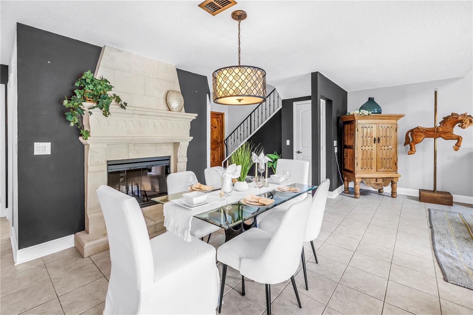 Cozy Fireplace in the Dining area fits perfectly for entertaining family and guests