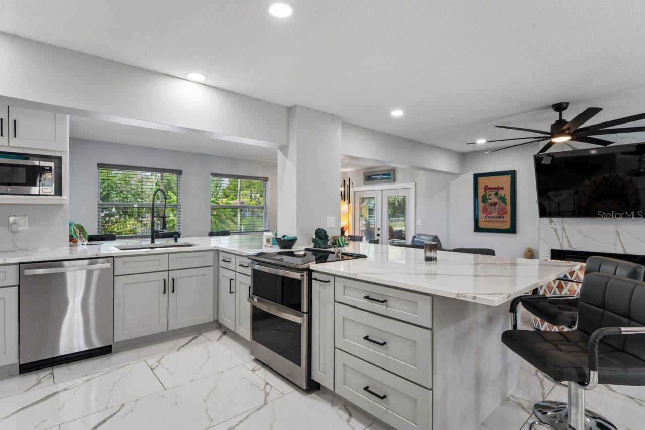New kitchen has all stainless-steel appliances and quartz countertops.