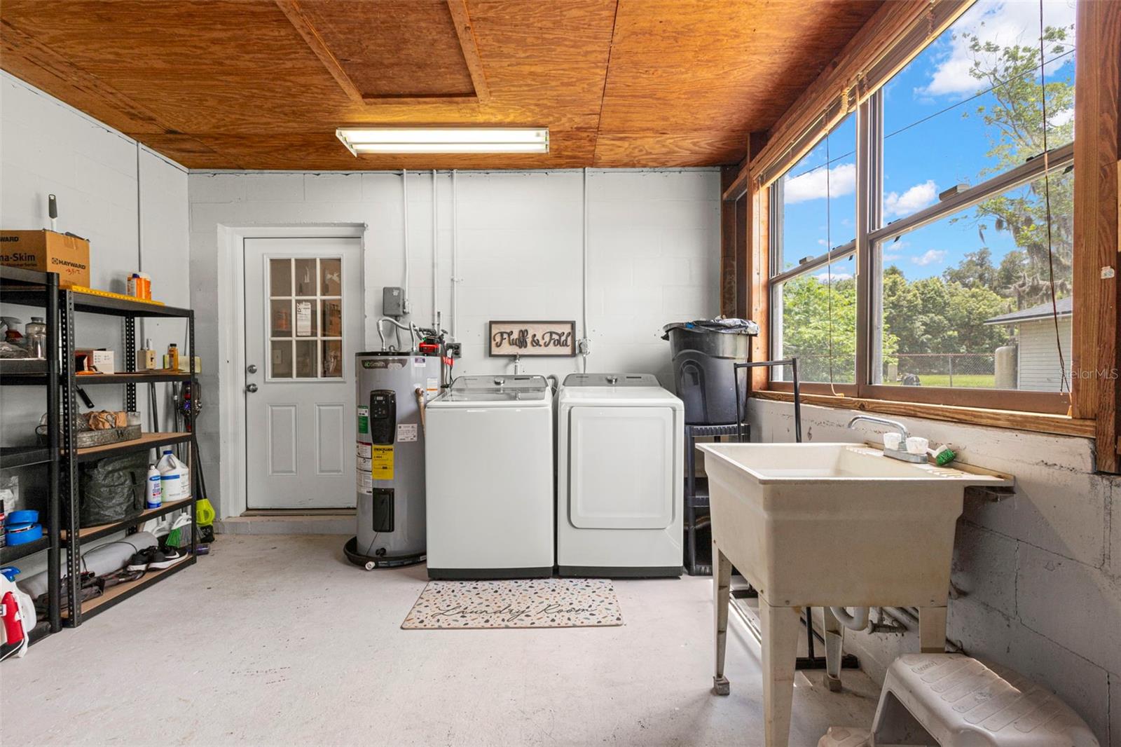Laundry area in attached 1 car garage