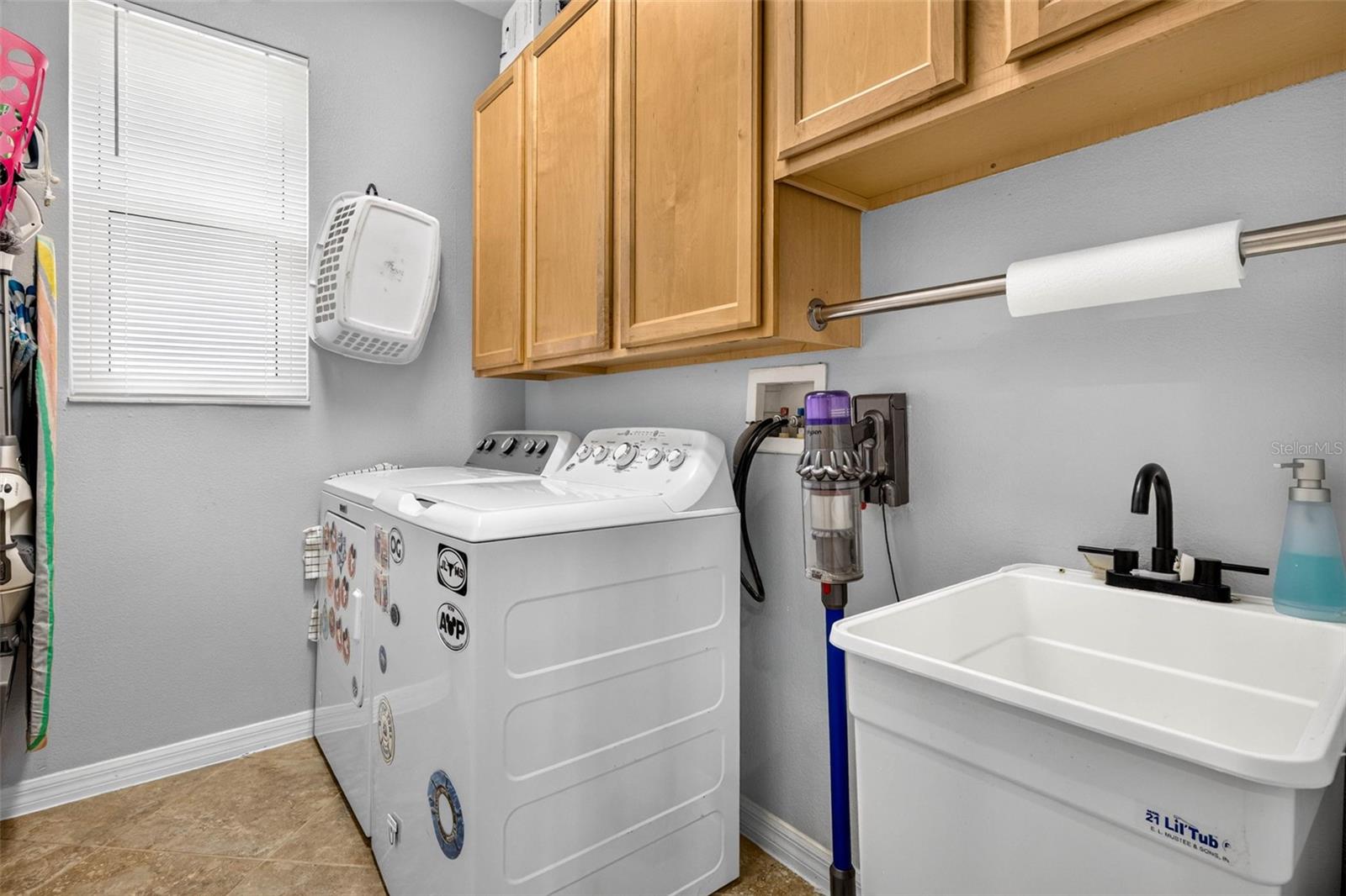Laundry Room with Utility Sink and Cabinetry