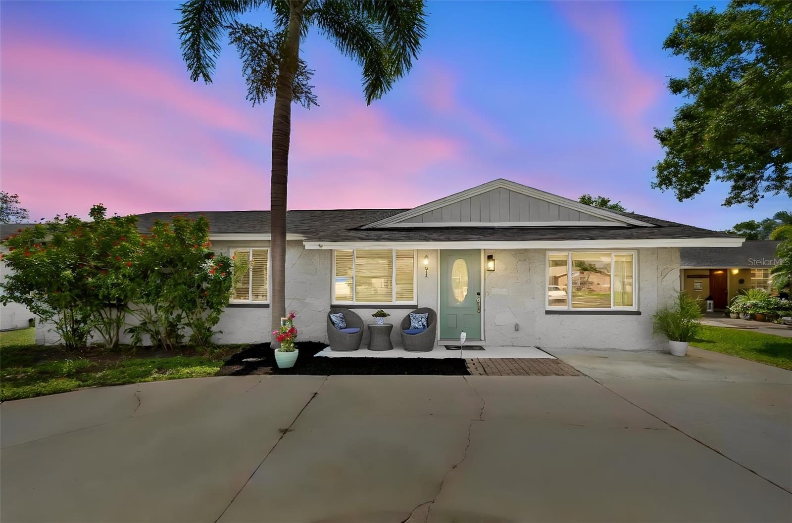 Welcome Home!  Enjoy the inviting front porch to catch the sunset colors to the West