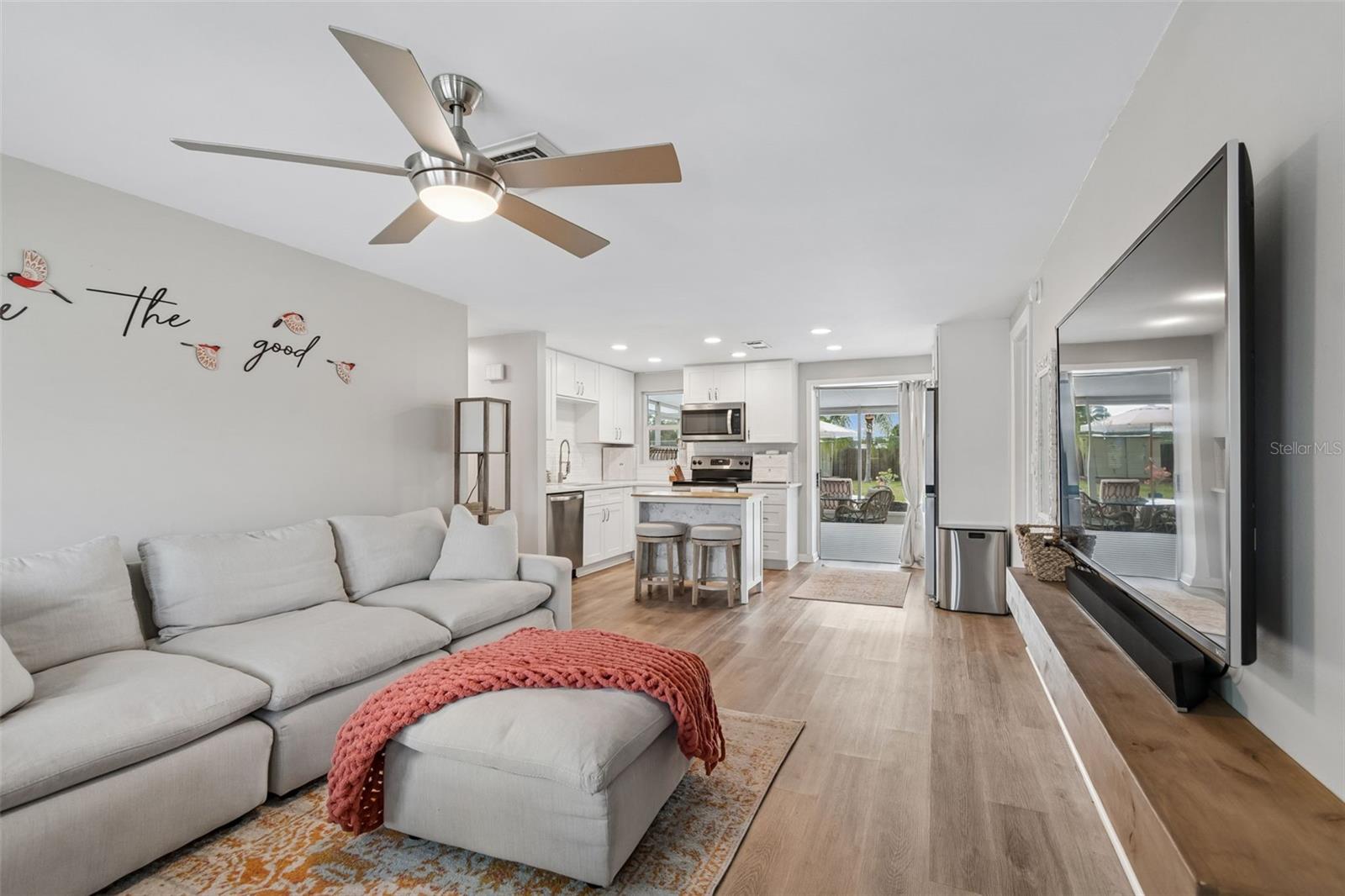 Lots of natural light to take the cozy setting in the center of house.   With the open concept of this space entertaining space flows effortless between the living room/kitchen to the patio/pool area.