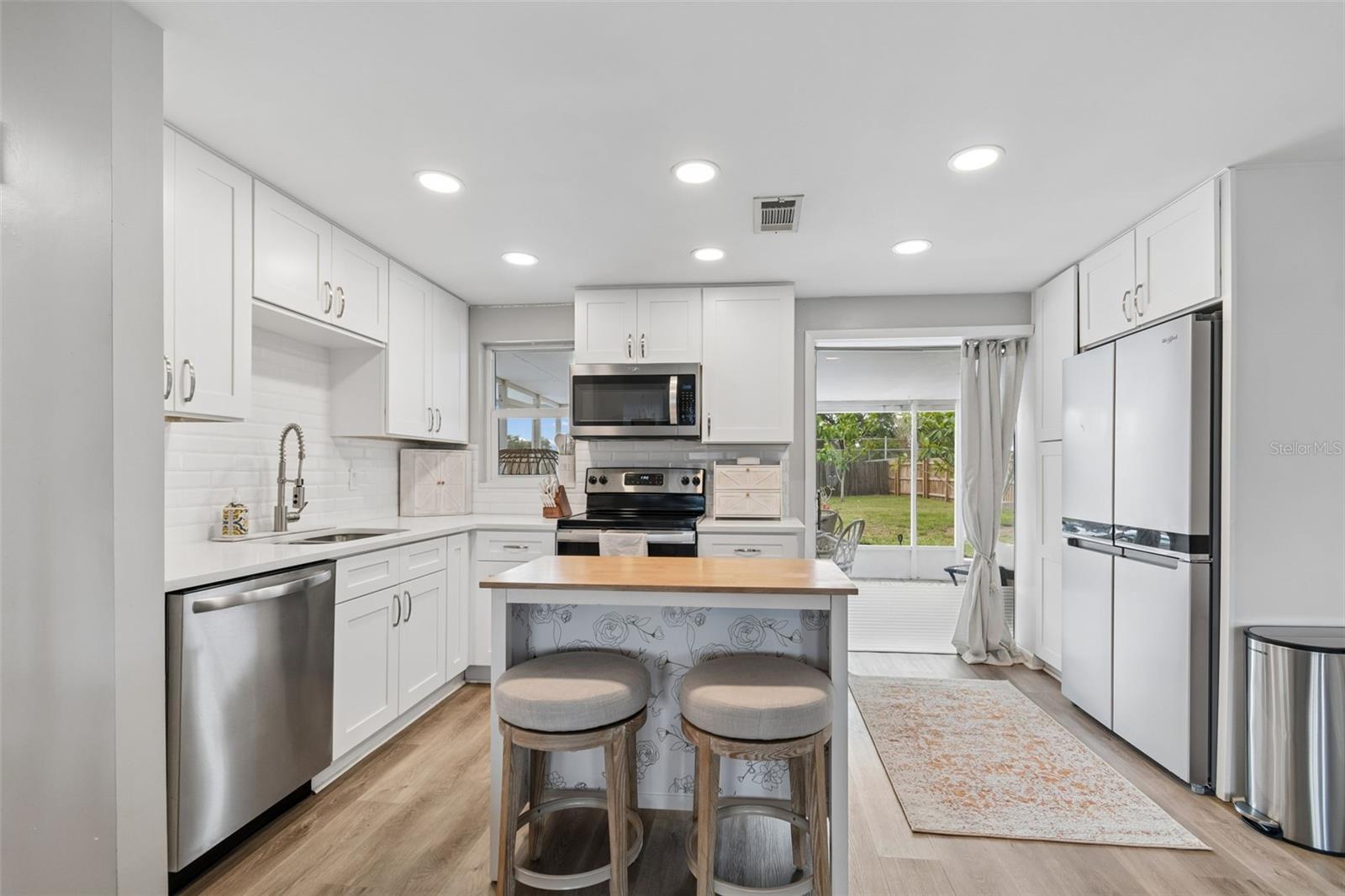 Shiny newer appliances and the dine in island draw your attention the moment you walk in the front door