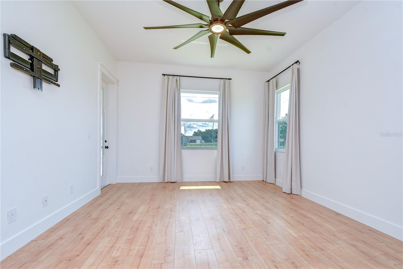 Spacious owner’s retreat filled with natural light from multiple windows.