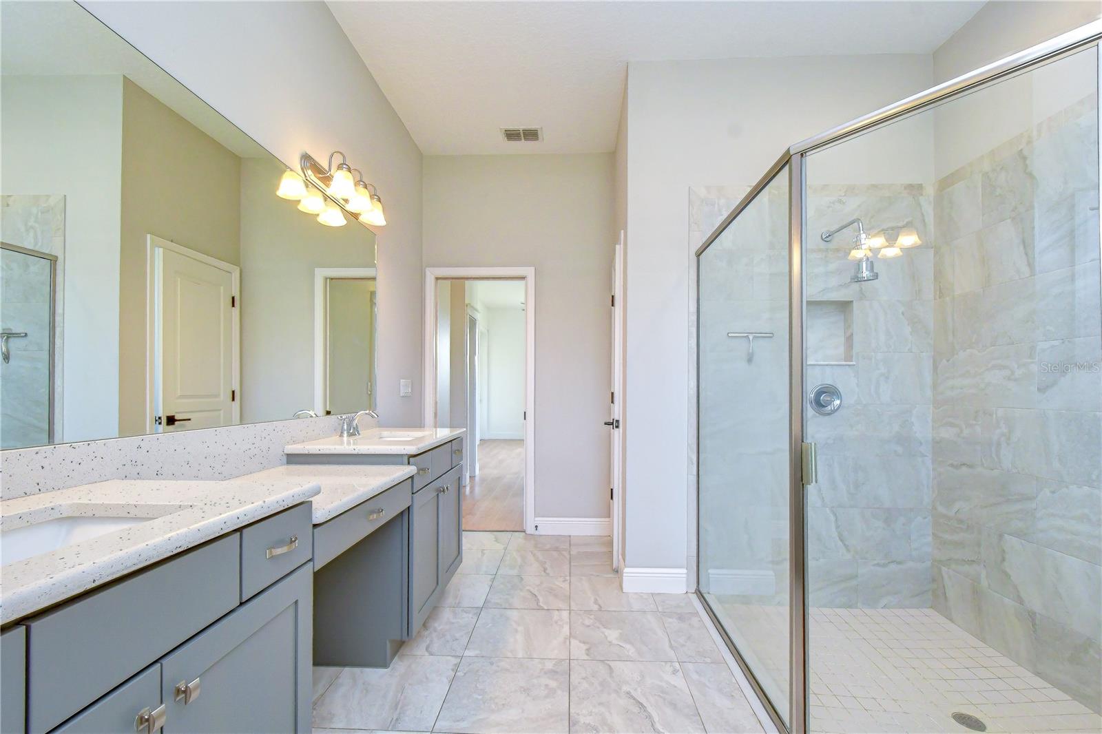 Spacious vanity area providing comfort and convenience.