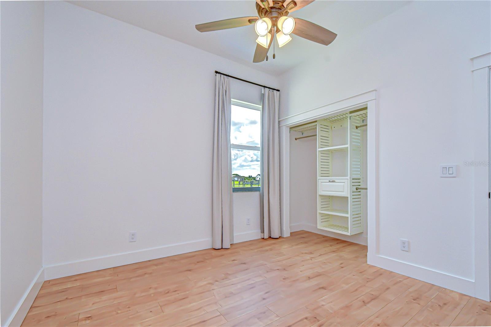Comfortable secondary bedroom with upgraded flooring.