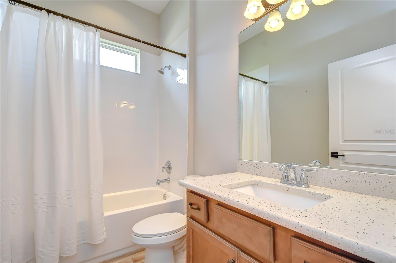 Well-appointed bathroom serving secondary bedrooms.
