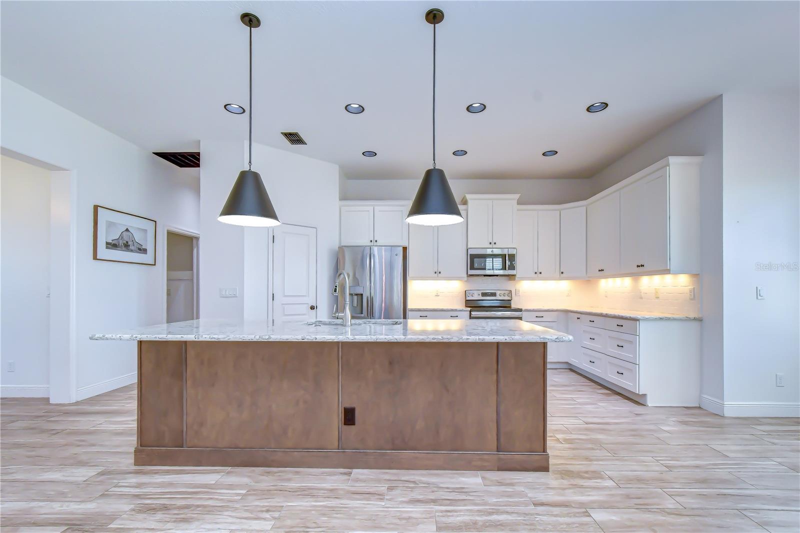 Stunning gourmet kitchen serving as the heart of the home.