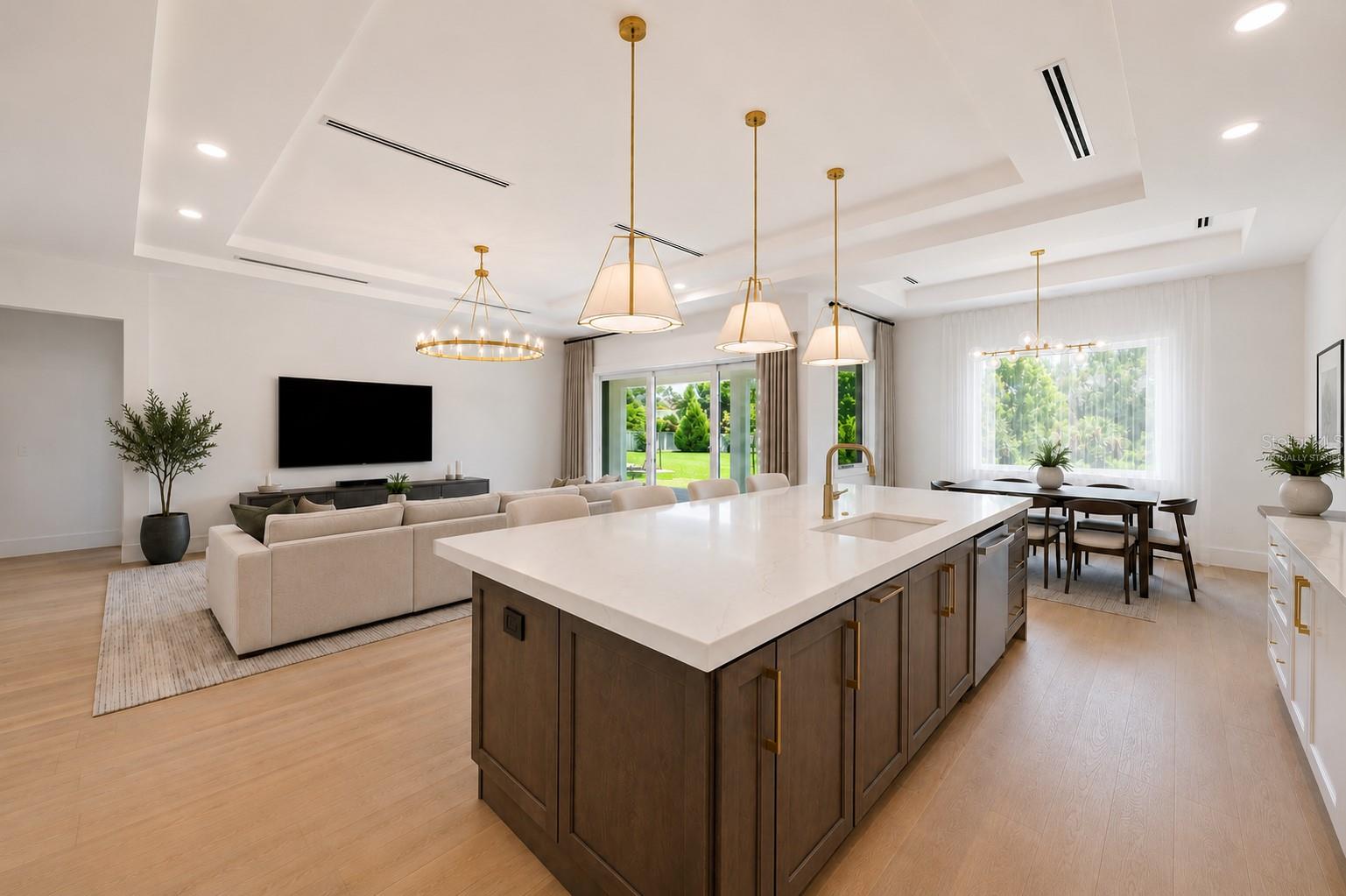 Virtually staged.The gourmet kitchen is a true showpiece, featuring full-height custom cabinetry, an oversized 11-foot quartz island with storage on both sides, marble backsplash, GE Profile appliances, custom range hood, cooktop, wall oven, and soft-close cabinetry throughout.