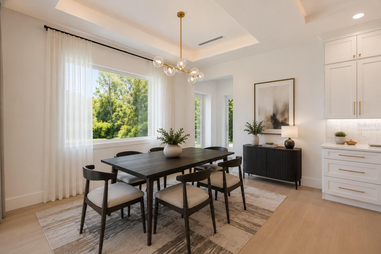 Virtually staged. Light and bright Dining area.