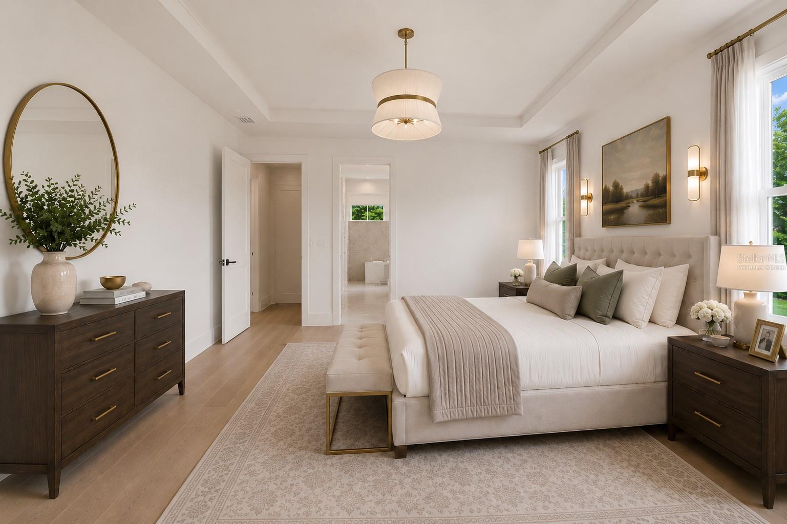 Virtually staged.The luxurious primary suite offers a spa-inspired retreat featuring a freestanding soaking tub, oversized walk-in shower with rain head and handheld shower, premium Italian tile, designer fixtures, and thoughtful custom details throughout.