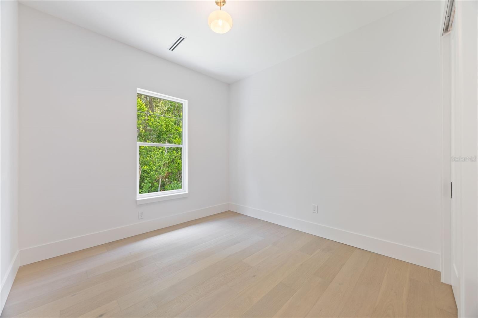 Bedroom 2 is generously sized and conveniently located near a full guest bathroom.