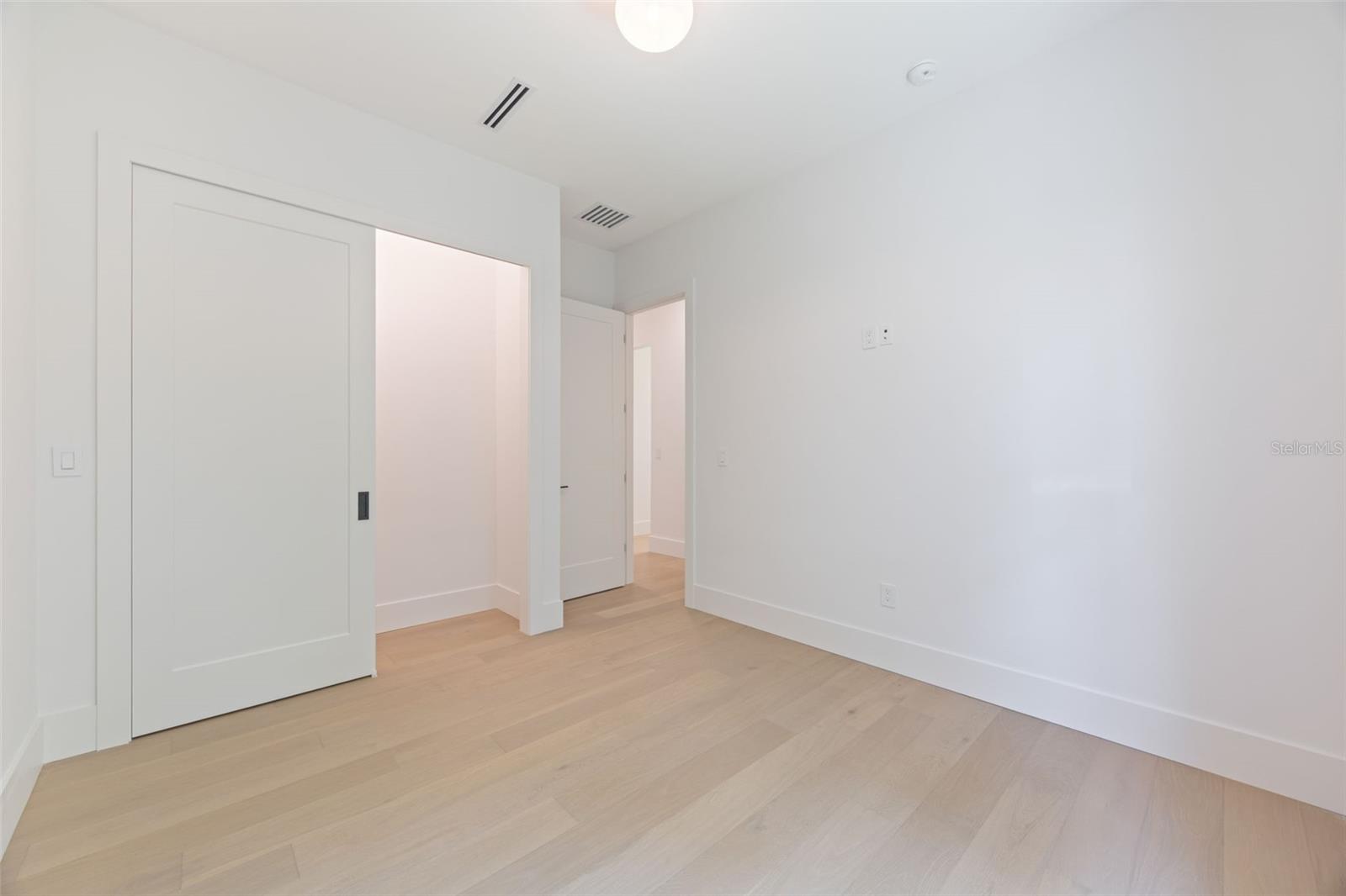 Bedroom 2 is generously sized and conveniently located near a full guest bathroom.
