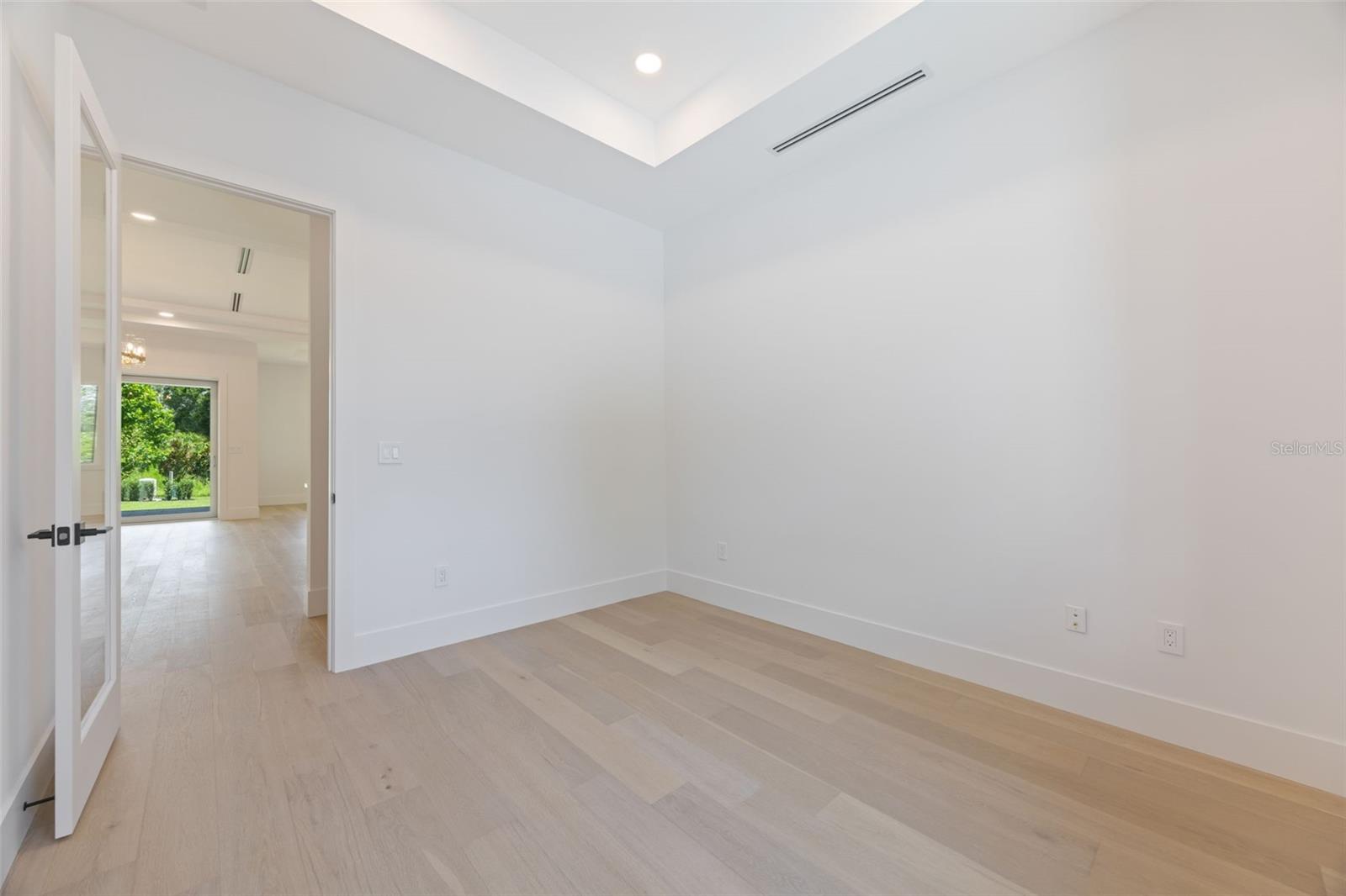 A dedicated office/study room provides the perfect work-from-home space while maintaining privacy from the main living areas.