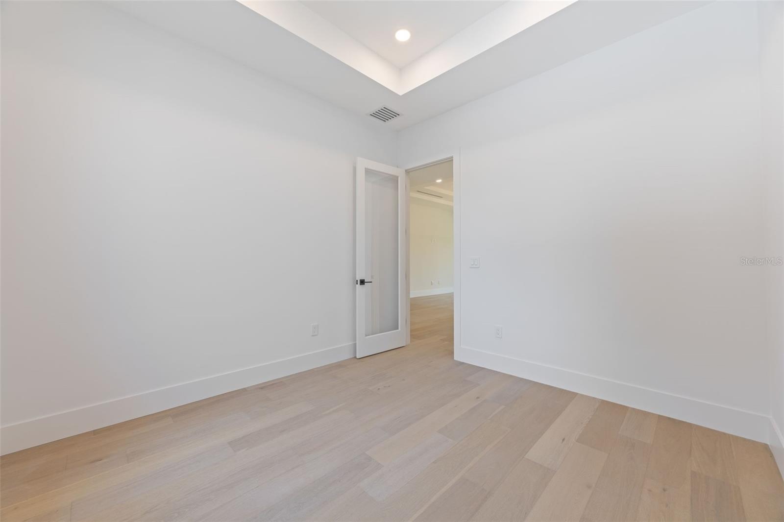 A dedicated office/study room provides the perfect work-from-home space while maintaining privacy from the main living areas.