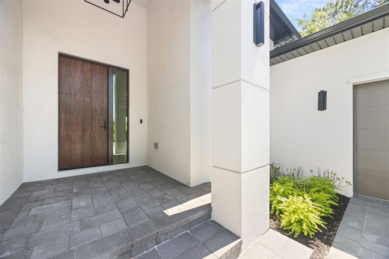 Premium Mastergrain Cherry fiberglass entry door with:Multipoint locking system, impact-rated Low-E sidelight,EMTEK designer hardware,realistic woodgrain finish with advanced, Nickel Vapor Deposition technology.