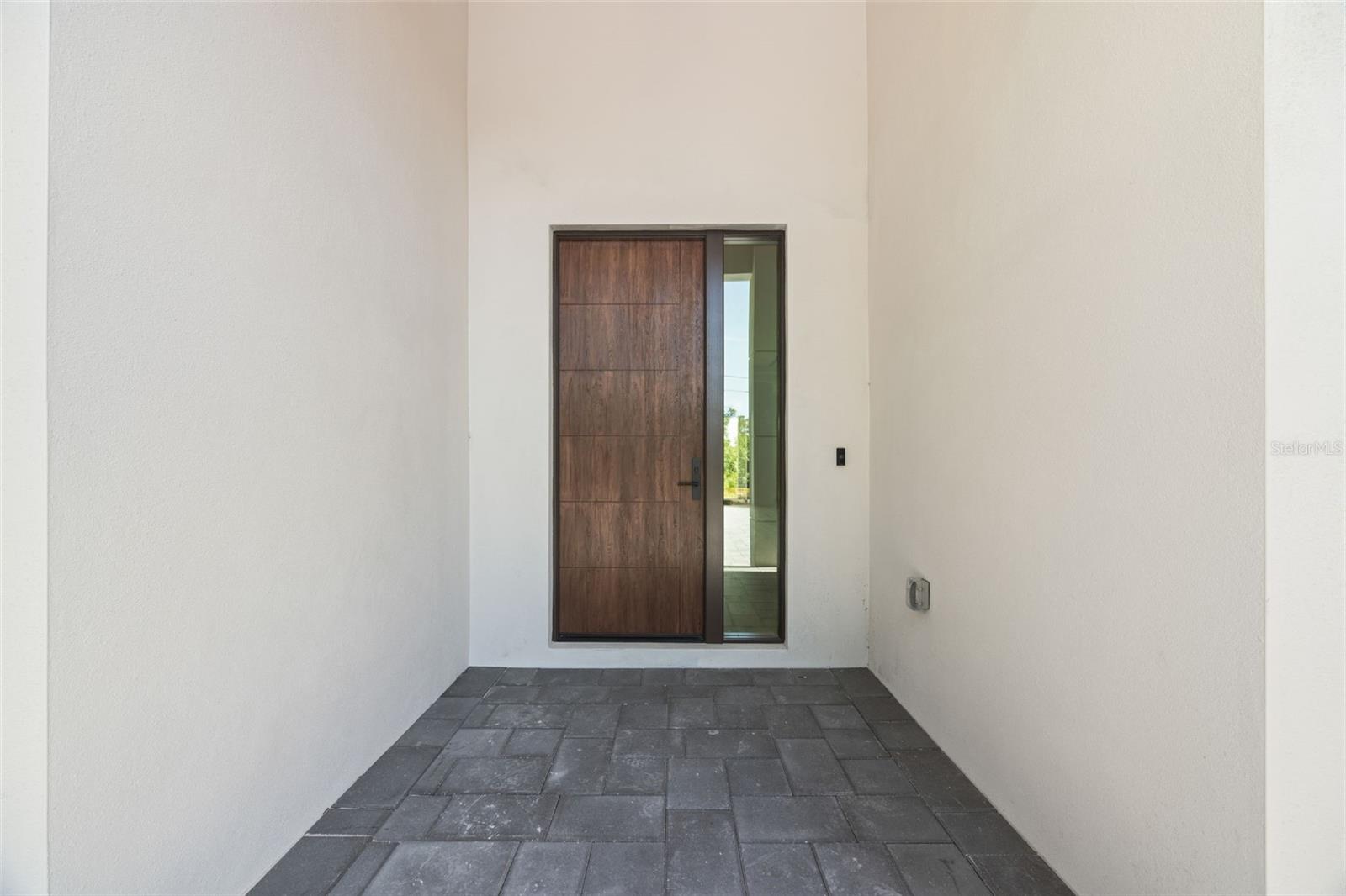 Premium Mastergrain Cherry fiberglass entry door with:Multipoint locking system, impact-rated Low-E sidelight,EMTEK designer hardware,realistic woodgrain finish with advanced, Nickel Vapor Deposition technology.