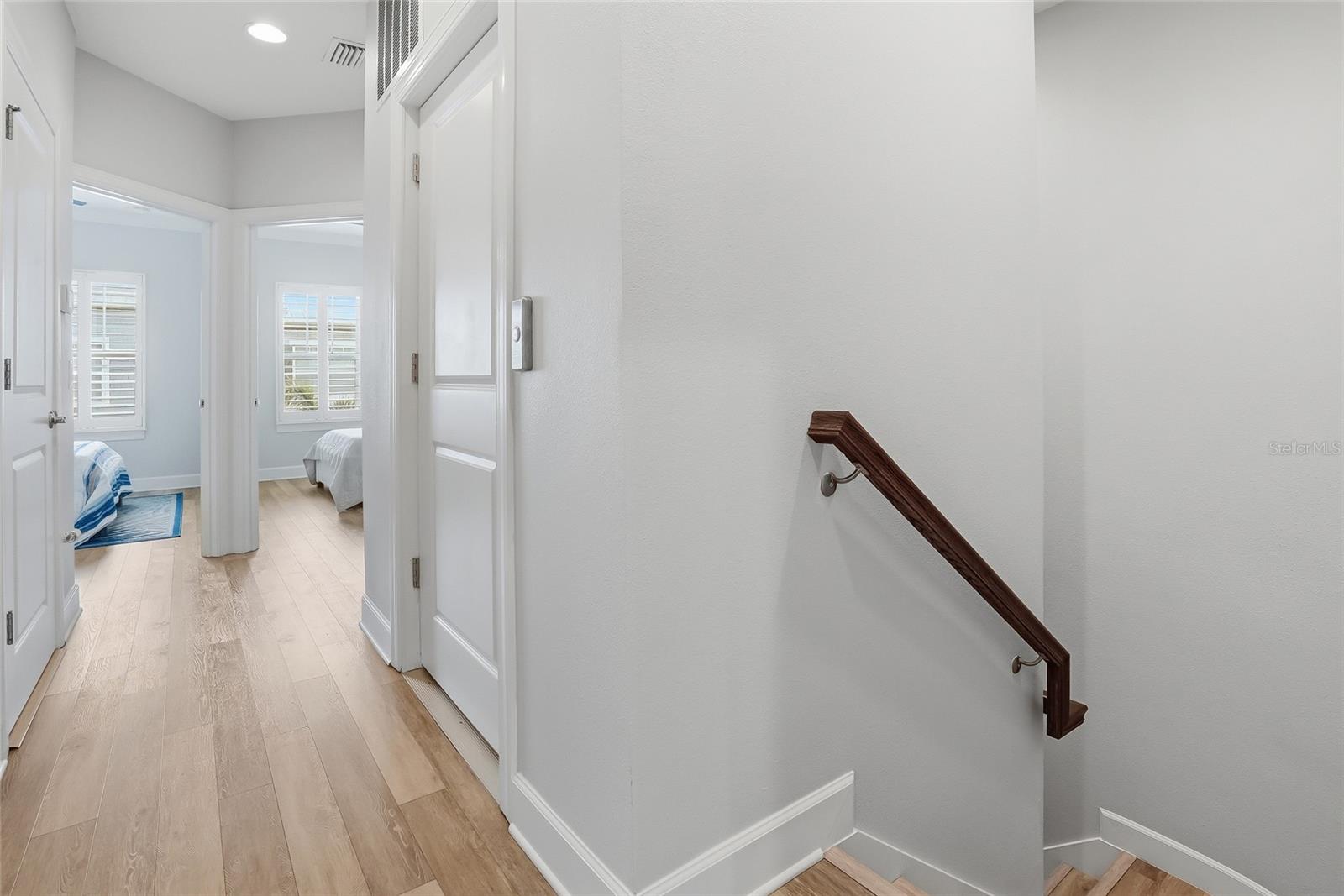 Door to the right is the elevator which accesses the top floor which has three bedrooms, 2 bathrooms and the laundry room.